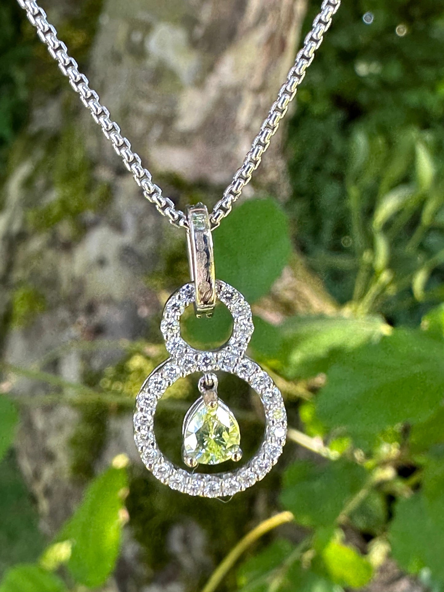 Pendant 18ct white gold necklace set with a 0.31ct lime pear shape certified diamond