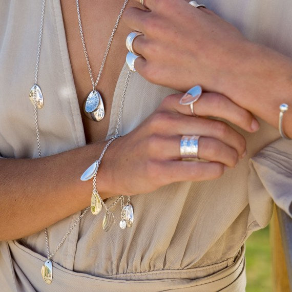 Crafted silver pebble-shaped charm bracelet Bracelet Sea Gems Ltd