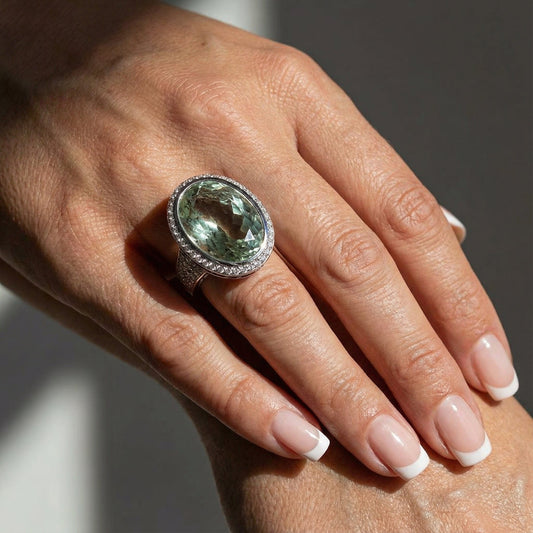 18ct White gold 14.32ct Green Beryl ring surrounded by amethyst and diamonds Ring Buchwald