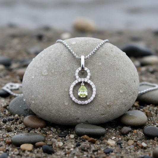 Pendant 18ct white gold necklace set with a 0.31ct lime pear shape certified diamond