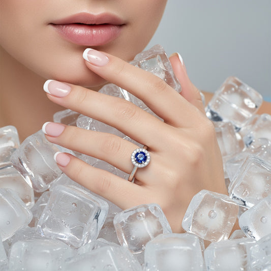 Platinum blue sapphire and diamond halo ring