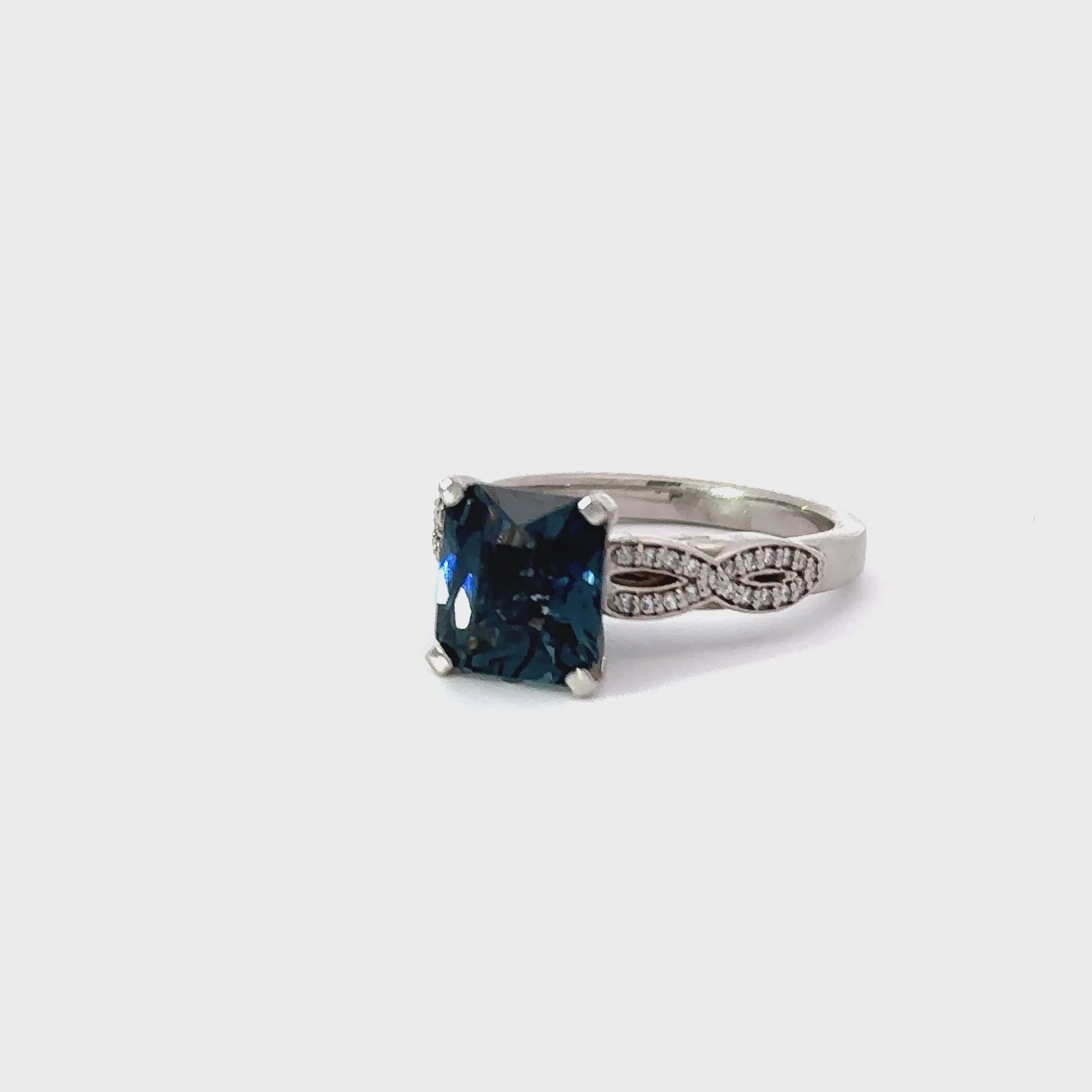 Palladium weaved shape ring set with a petrol blue spinel and diamonds Ring Stuller
