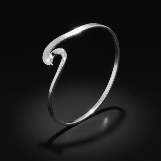Delightful silver curling waves bangle